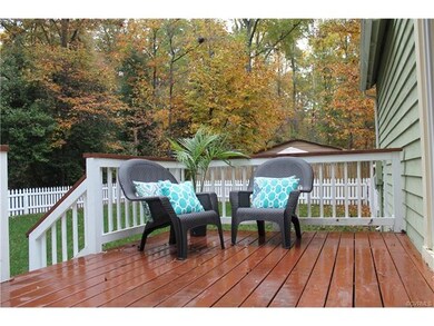 Private deck, off of the kitchen, provides a quain