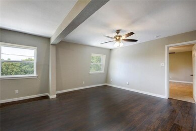 Unfurnished room with dark wood finished floors, 