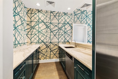 Amazing wet bar area with Calacatta marble counter