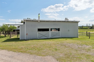 View of outbuilding with an exterior structure and a view of rural / pastoral area