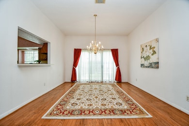 The brass chandelier is elegant. At the end of the