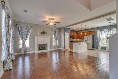 Come inside and enjoy this former model home with plenty of natural light, hardwood floors, open concept to join in the conversation