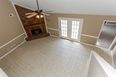 The roomy Great Room boasts neutral colors, tile f
