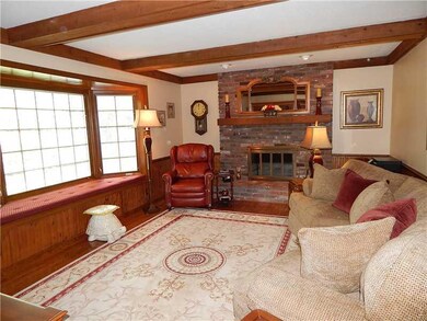 Family Room. Hardwood flooring, beamed ceiling and