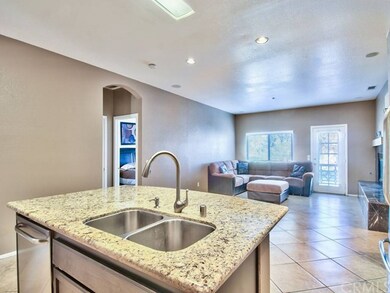 View from Kitchen Island to Family room. Open and 