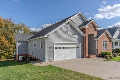 Left side of home featuring 2 car garage and gener