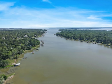 Bird's eye view featuring a view of trees and a wa