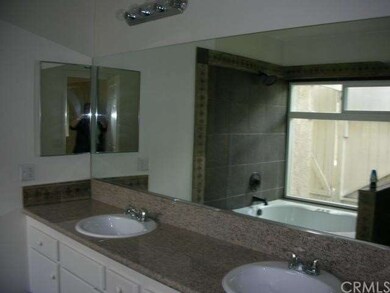 Dual sinks in Master Bath with spa tub.