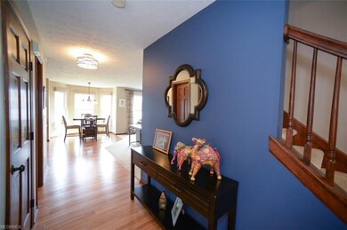 Wood laminate flooring in foyer/hallway