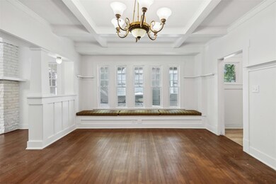 The dining room features a window seat as well pla