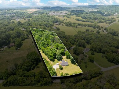 1809 SF + 3.8 acres, partially wooded, partially cleared.