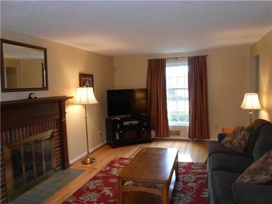 Living Room. Hardwood floors and brick woodburning