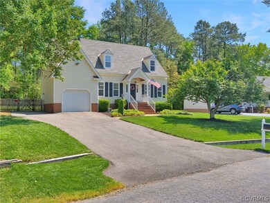 Cape cod home with a front yard