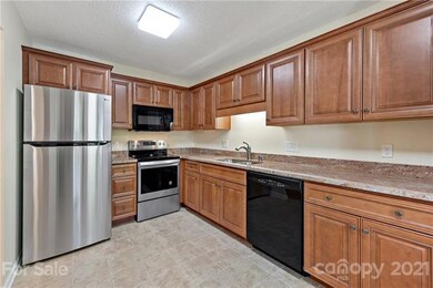 new kitchen appliances, granite counter, cabinets 