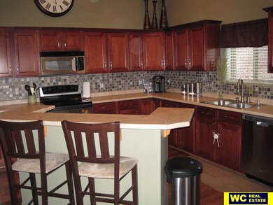 Great woodwork accenting the open kitchen design.