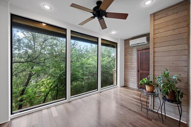 Sunroom / solarium featuring a wall mounted AC