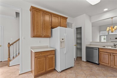 Kitchen featuring white fridge with ice dispenser,