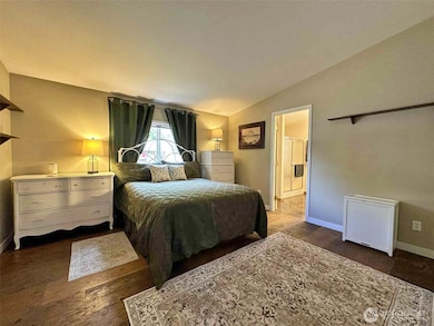 Primary with wood floors.