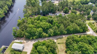 Aerial overview of property's location featuring a large body of water
