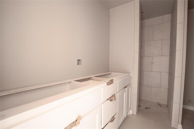 Bathroom with tile flooring and vanity