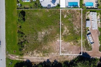 Aerial overview of property's location featuring property parcel outlined