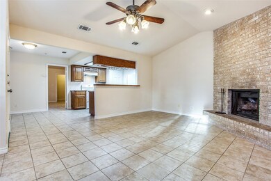 Unfurnished living room featuring light tile patt