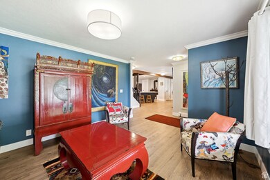 Interior space featuring wood finished floors and ornamental molding