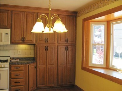 Newer cabinets showing dining area with bay window