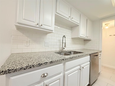 Kitchen featuring stainless steel dishwasher, a s