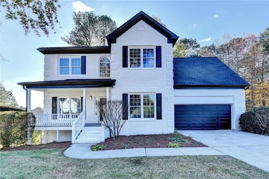 Traditional-style home with concrete driveway, an 