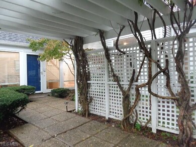 Lovely covered walkway with privacy fence and pere