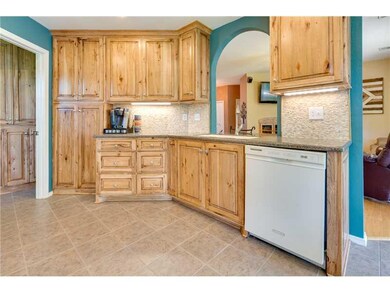 Kitchen. Great storage and instant hot water in this kitchen.  Note the under cabinet lights and backsplash.