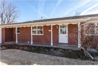 Covered front porch welcomes your guests