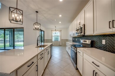 Kitchen with appliances with stainless steel finis