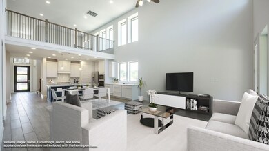 Living room with a towering ceiling, recessed lig