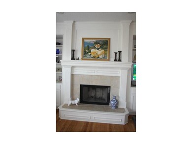 Fireplace with built-ins on either side.