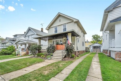 View of front facade with a front yard and covered porch