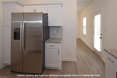 Appliance package includes a side by side GE stainless steel refrigerator.