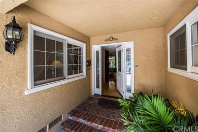 Front entry has custom stone flooring. 