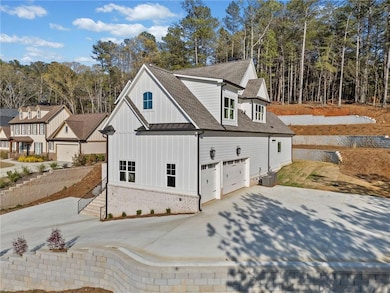 View of property exterior featuring driveway, a st