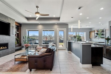 Living area featuring recessed lighting, a firepl