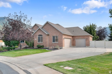 View of front of home with brick siding, a gate, concrete driveway, a shingled roof, and a garage