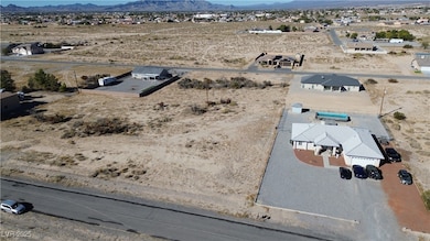 Overview of rural landscape with a desert landscape and a mountainous background