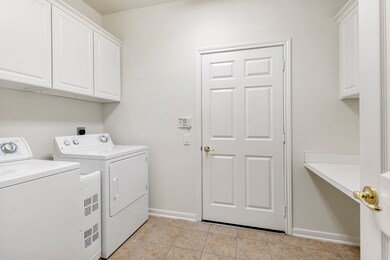 2-car garage conveniently opens into the laundry/mud room with plenty of additional overhead storage and work station.