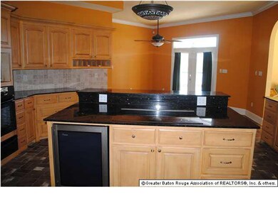kitchen. Large island with smooth top stove with d