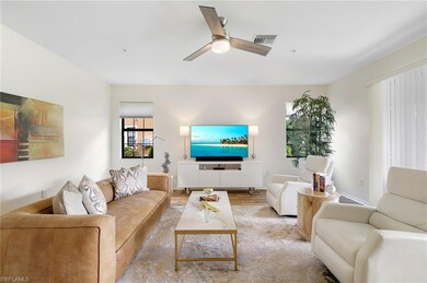 Living area featuring wood finished floors and ceiling fan