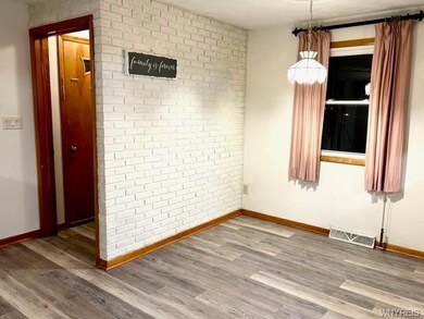 Cozy Dining area opens up into Living Room.