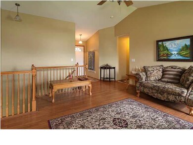 Spacious living room with wood laminate flooring.