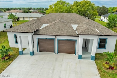 Ranch-style home with a shingled roof, stucco siding, a garage, concrete driveway, and a front lawn