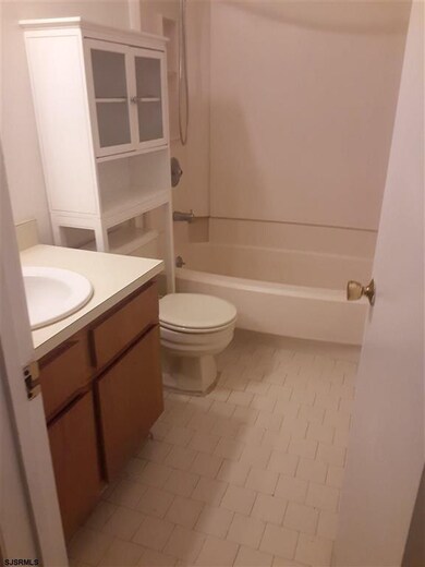 Nice size bathroom with extra cabinet.